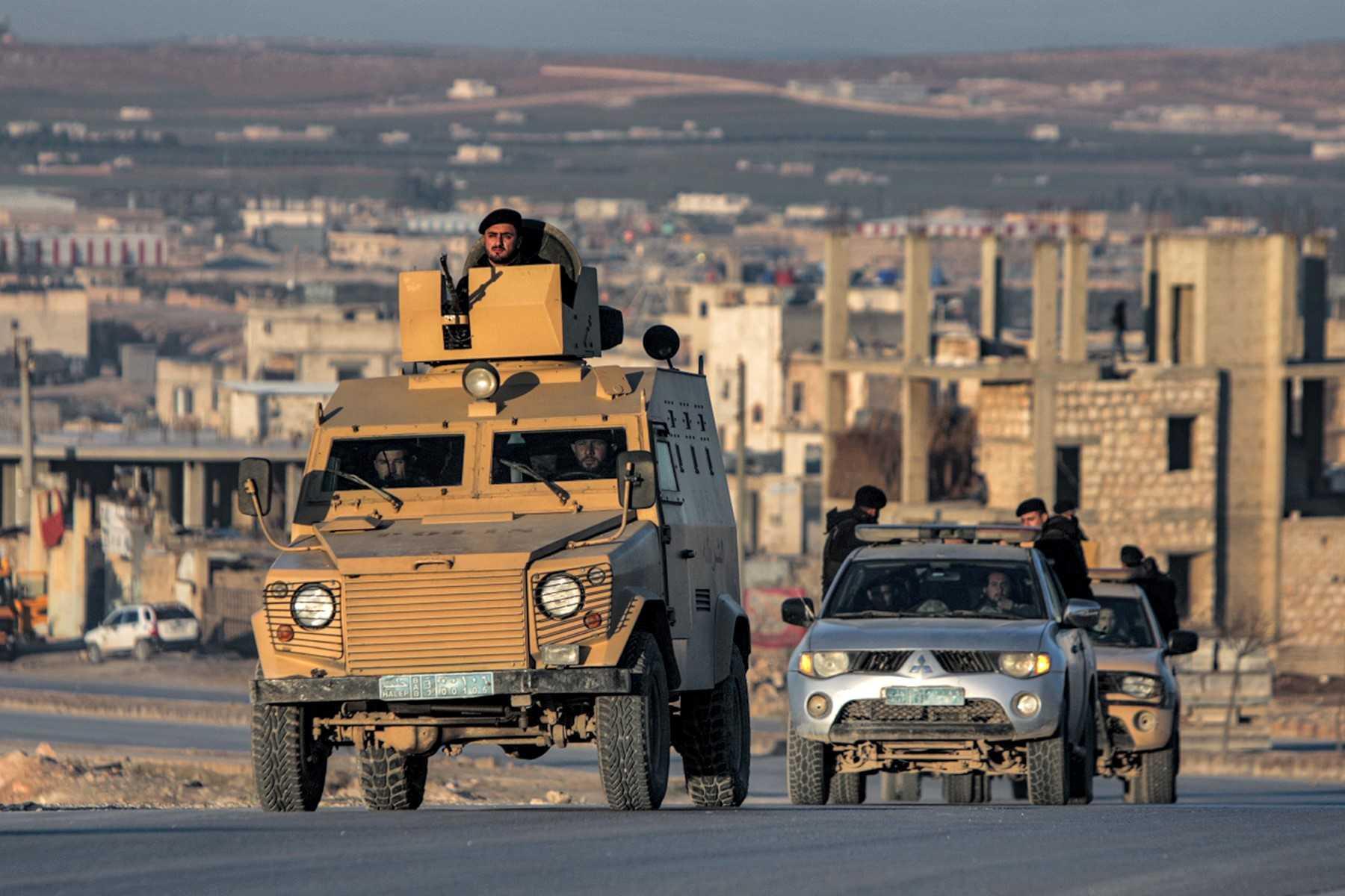 Turkey-backed Syrian fighters deploy in vehicles in al-Bab in the northern rebel-held part of Syria's Aleppo province on Jan 3. Photo: AFP 