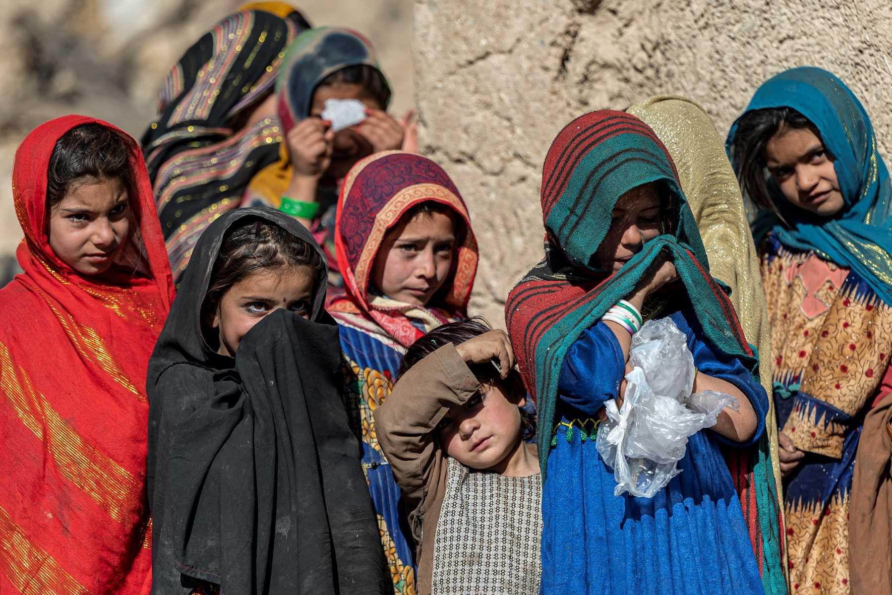Afghan children stand in front of their house in Barmal district of Paktika province on Dec 15, 2022. Photo: AFP