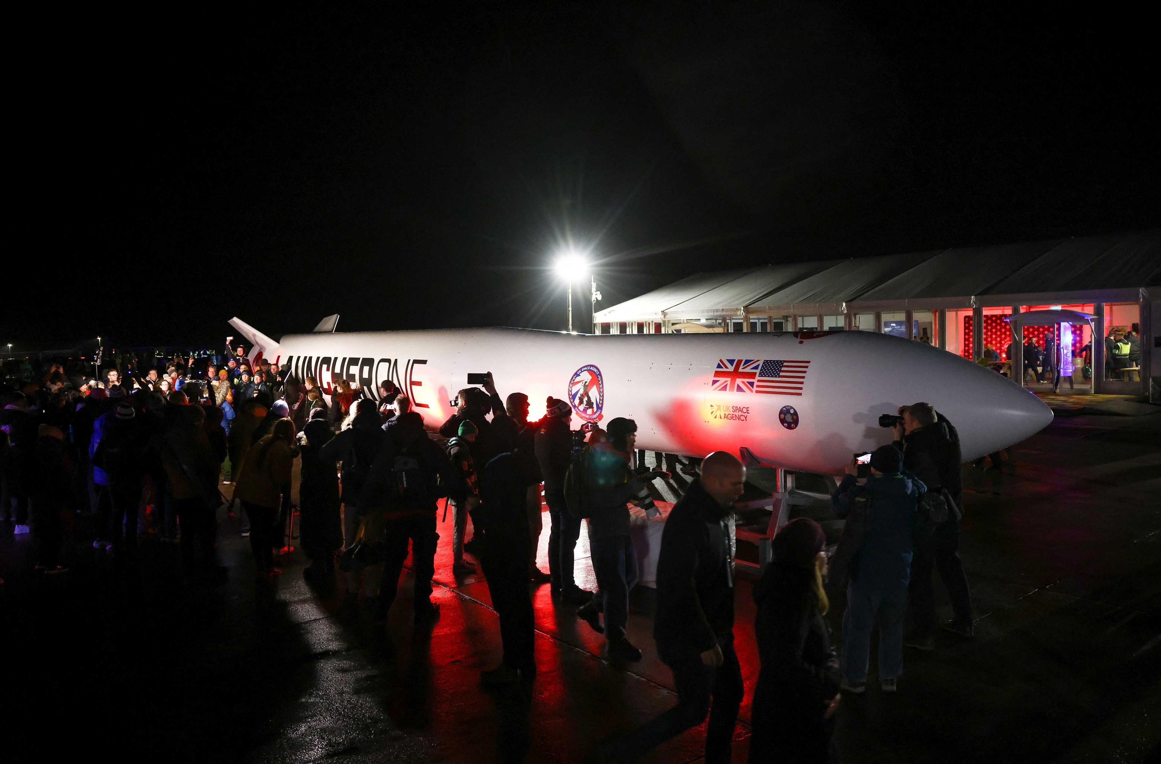 Spectators gather around a replica rocket at Cornwall Airport Newquay to watch the first ever UK launch of Virgin Orbit's LauncherOne rocket from Spaceport Cornwall in Newquay, Britain, Jan 9. Photo: Reuters