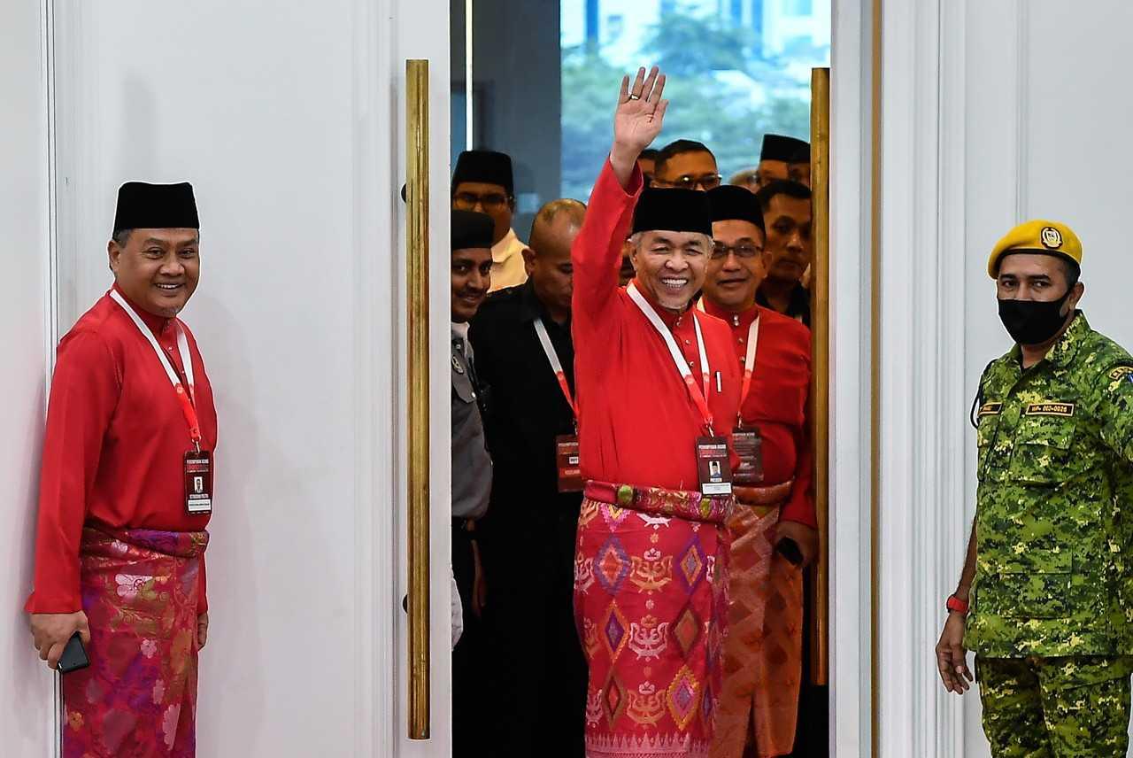Umno president Ahmad Zahid Hamidi waves at the party’s 2022 general assembly at the World Trade Centre in Kuala Lumpur, Jan 13. Photo: Bernama