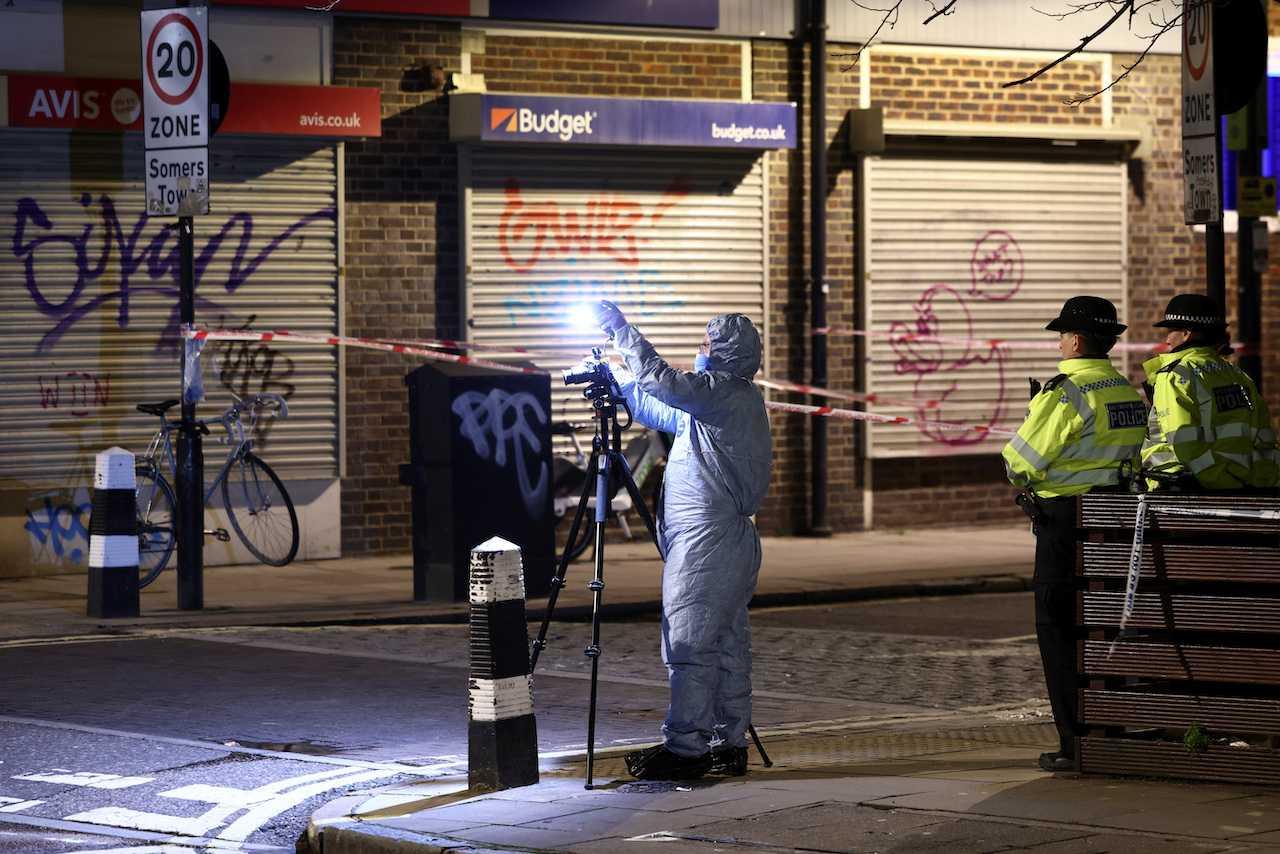 A forensics officer works at the scene of a shooting at a church in London, Britain, Jan 14. Photo: Reuters