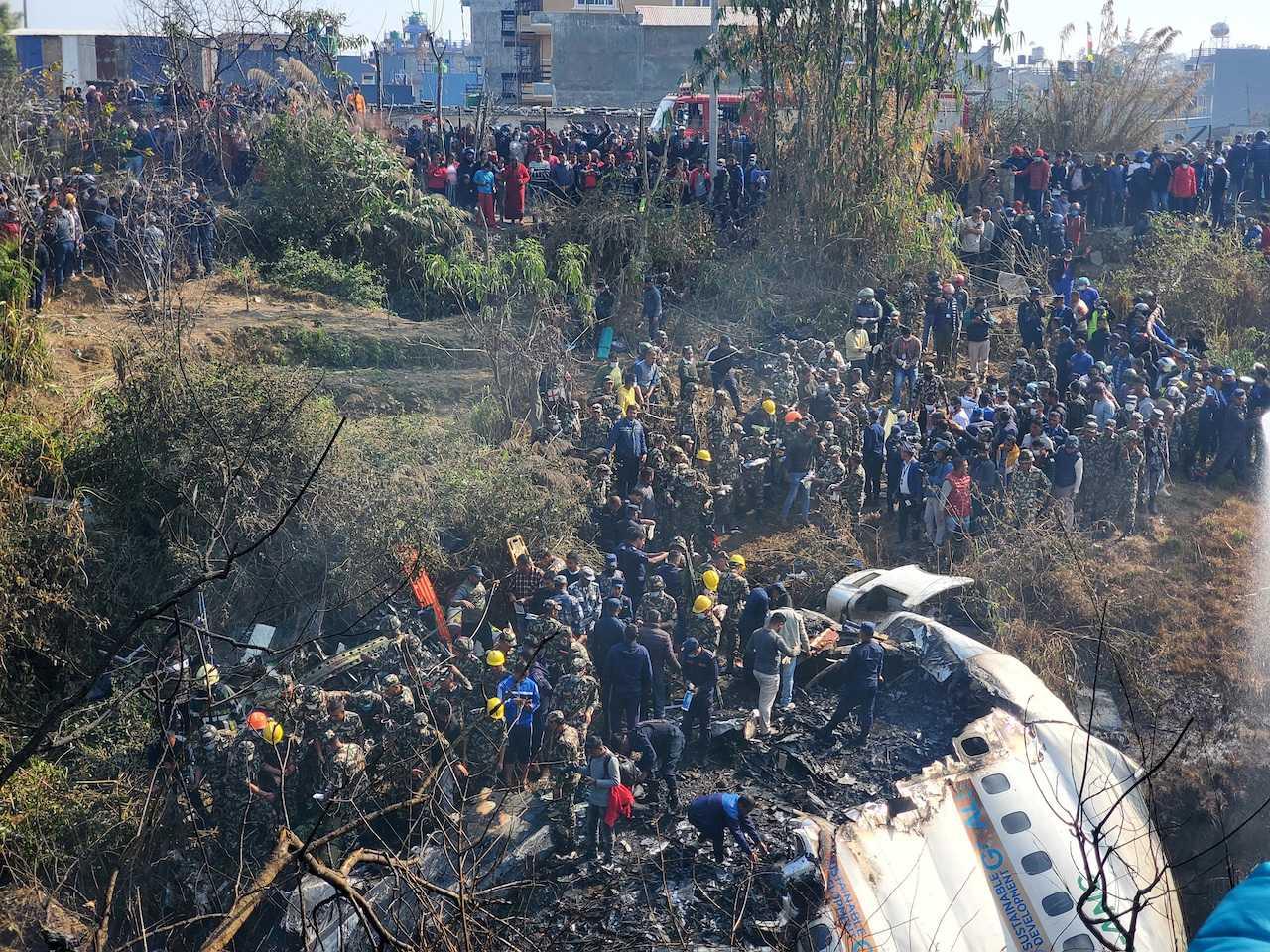 A general view of people gathered after a plane crash in Pokhara, Nepal, Jan 15, in this picture obtained from social media. Photo: Reuters