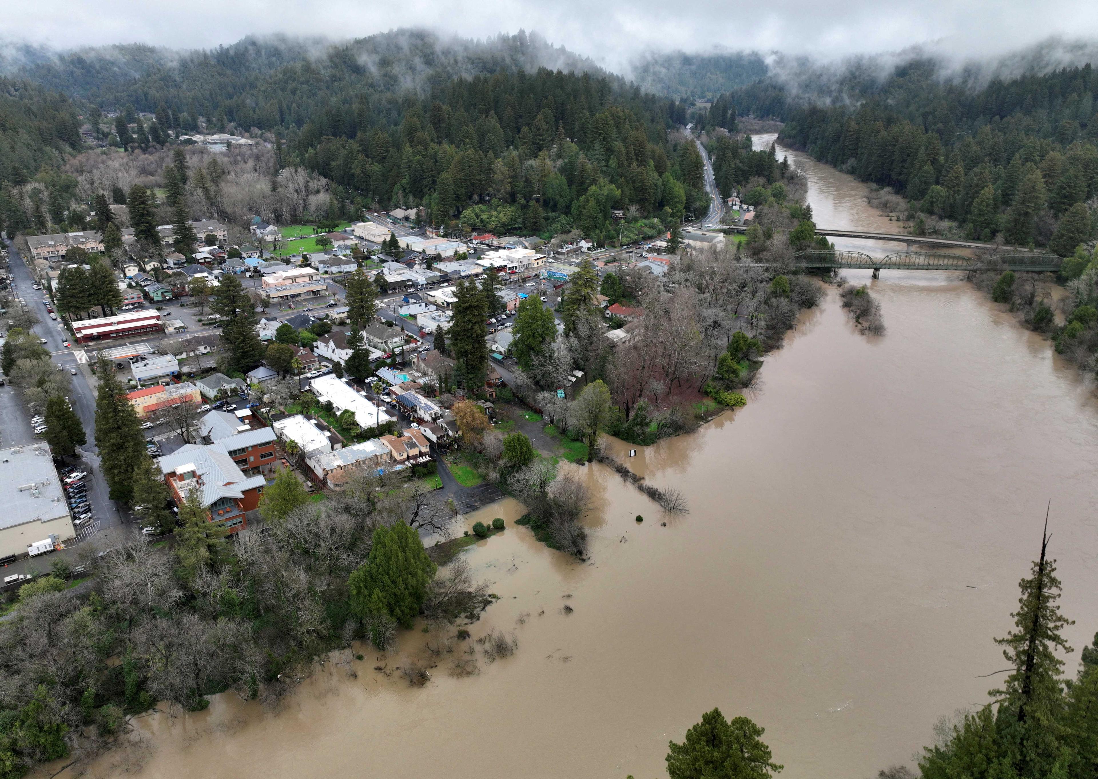 The Russian River, swollen with floodwater following a chain of winter storms, flows past the town of Guerneville, California, US Jan 15. Photo: Reuters