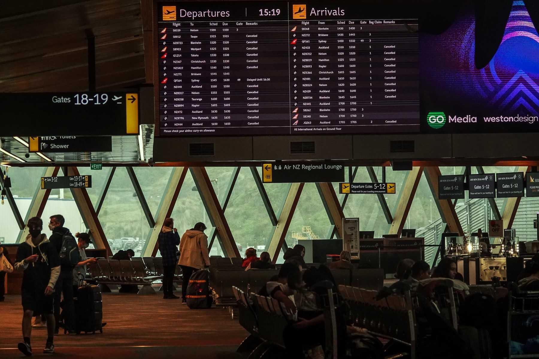 A flight information board shows flights at the airport in Wellington on July 21, 2022. Photo: AFP 