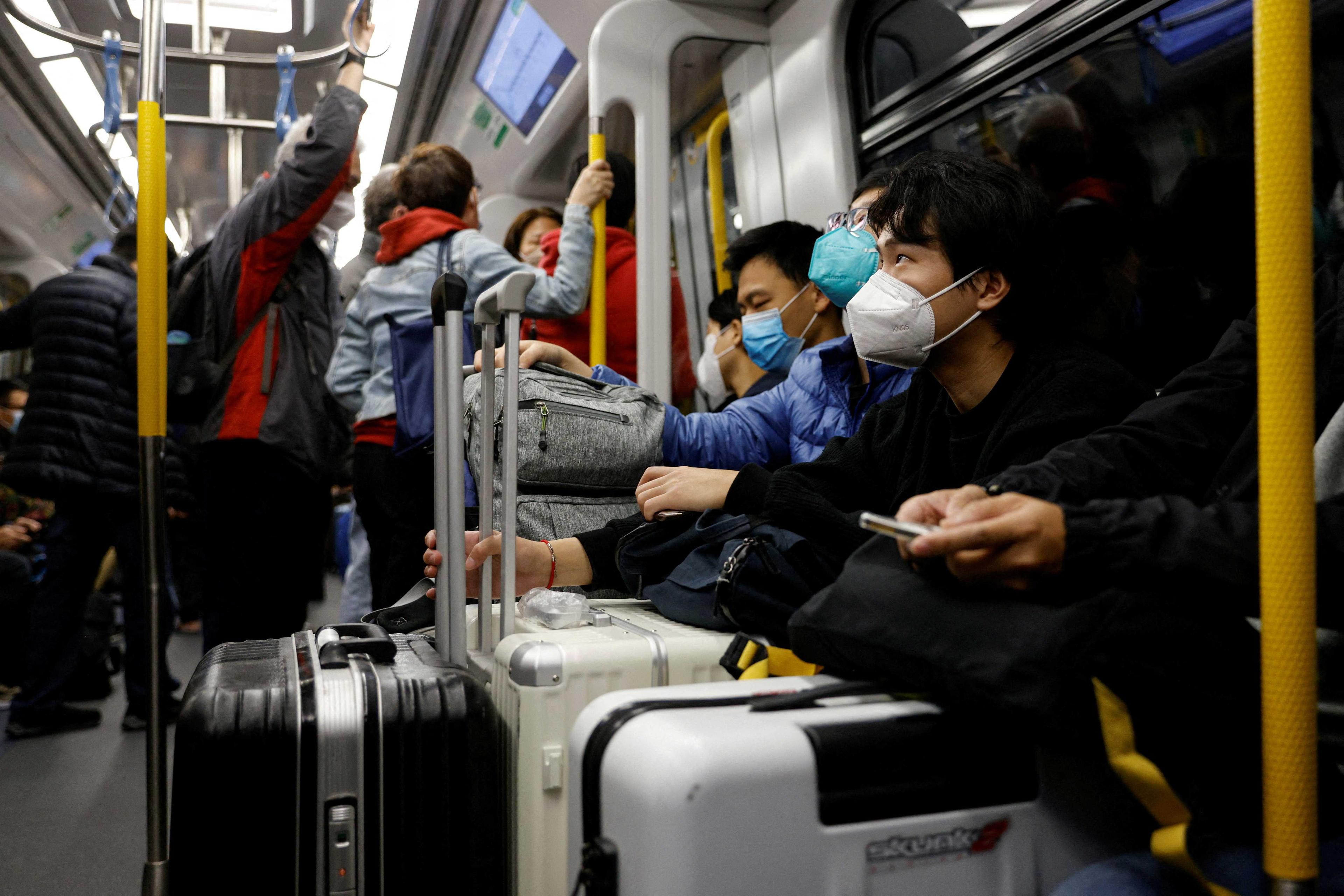 Travellers take the first train to Hong Kong's Lok Ma Chau border checkpoint on the first day China reopens the border amid the Covid-19 pandemic in Hong Kong, China, Jan 8. Photo: Reuters