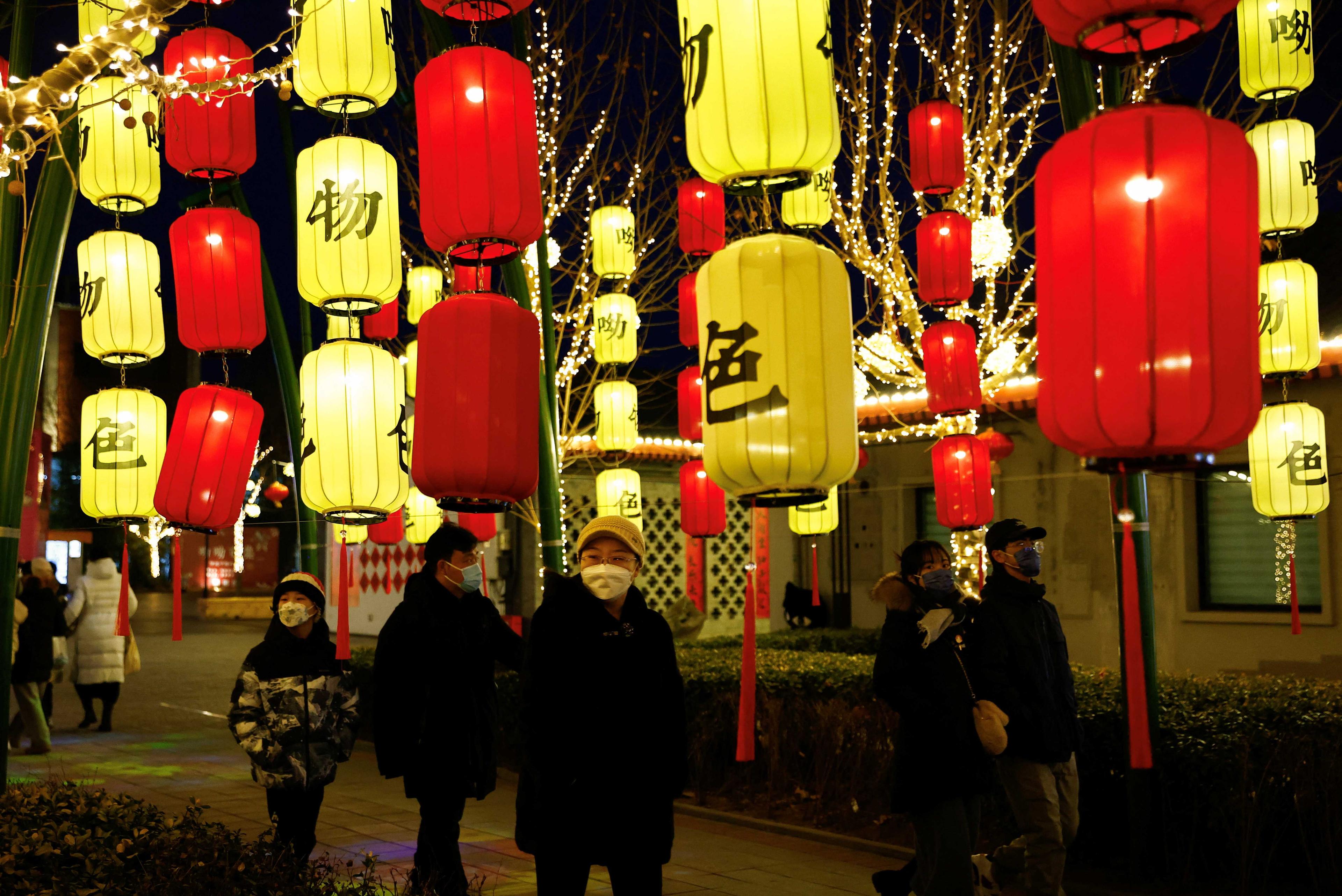 People walk past lanterns decorating a Chinese Lunar New Year festive market in Beijing, China Jan 14. Photo: Reuters