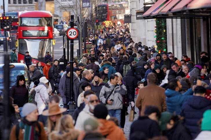 People walk along a busy shopping street, during the traditional Boxing Day sales in London, Britain, Dec 26, 2022. Photo: Reuters
