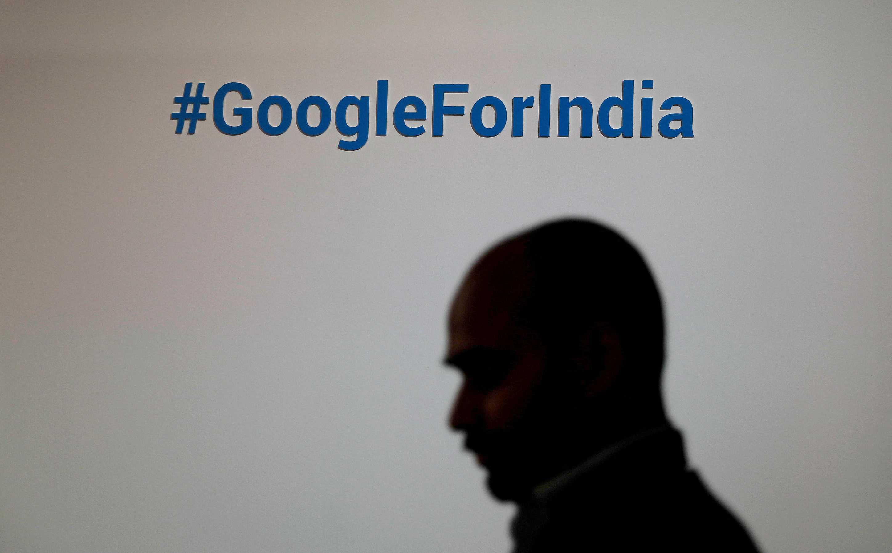 A man walks past a Google hashtag during an event in New Delhi, India, Aug 28, 2018. Photo: Reuters