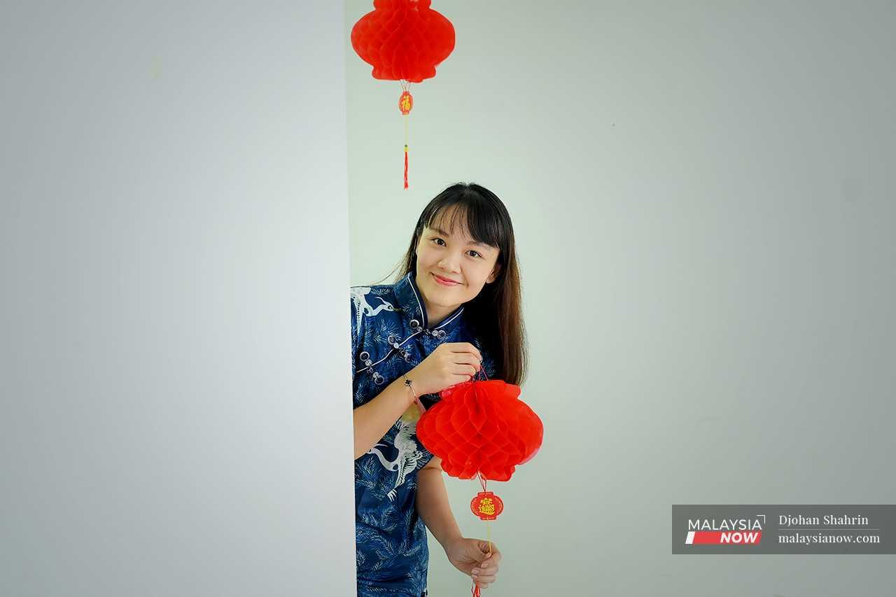 Her cheongsam this year is dark blue, as she recently lost a family member, but she looks forward to celebrating Chinese New Year nonetheless, and to travelling back to her hometown in Sitiawan, Perak, to be with her parents. 
