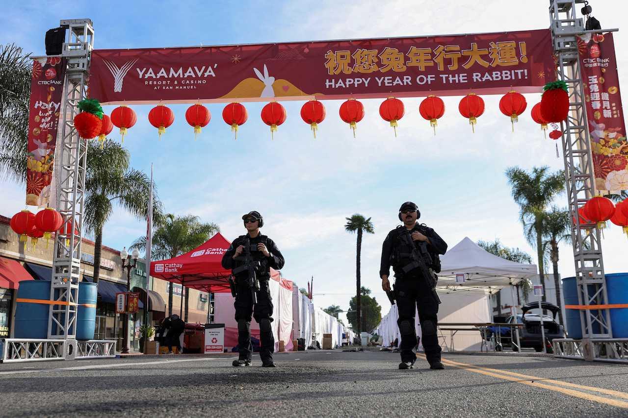 Police officers guard the area near the location of a shooting that took place during a Chinese New Year celebration, in Monterey Park, California, Jan 22. Photo: Reuters