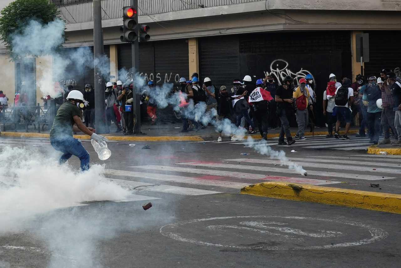 Protesters clash with police officers during an anti-government demonstration following the ouster of former president Pedro Castillo, in Lima, Peru, Jan 24. Photo: Reuters