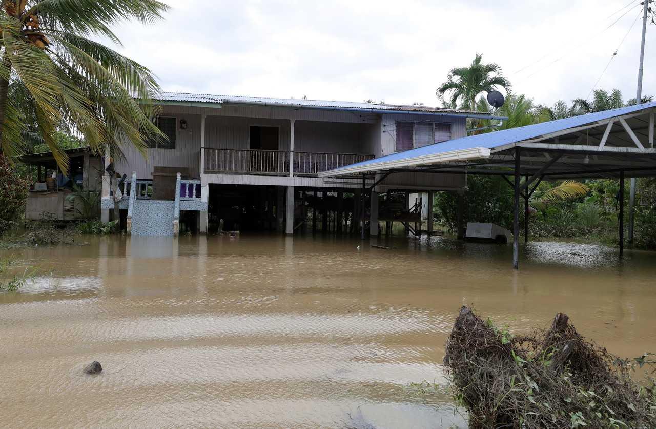 A house is partly submerged in water at Kampung Ongkilan in Kota Marudu, Sabah, Jan 26. Photo: Bernama
