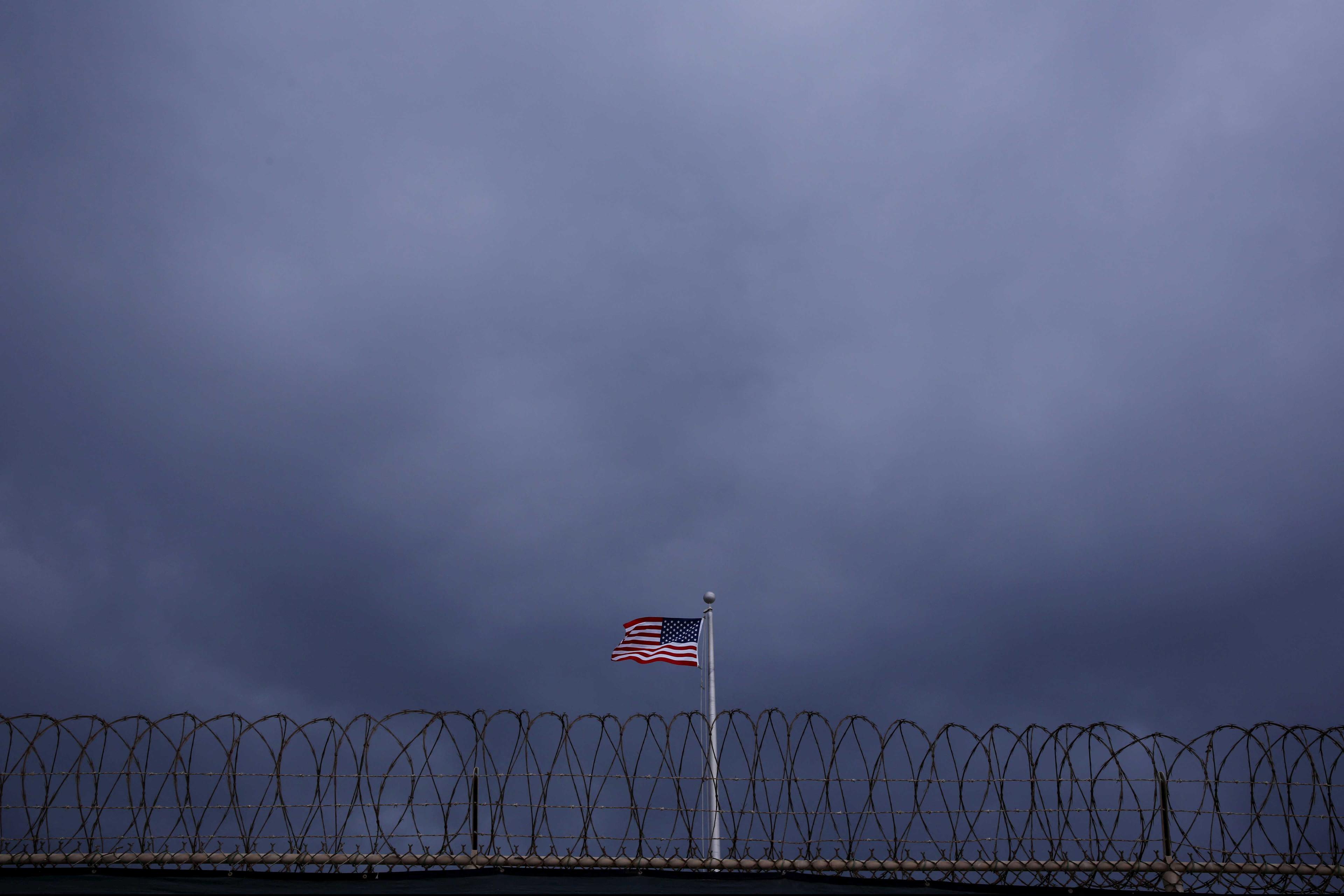 The US flag flies inside of a camp at the US Naval Base in Guantanamo Bay, Cuba March 22, 2016. Photo: Reuters