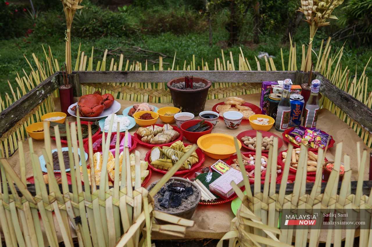 Offerings of food are laid out on a platform ahead of the 'Puja Pantai', a  thanksgiving ritual for the spirits of the sea.
