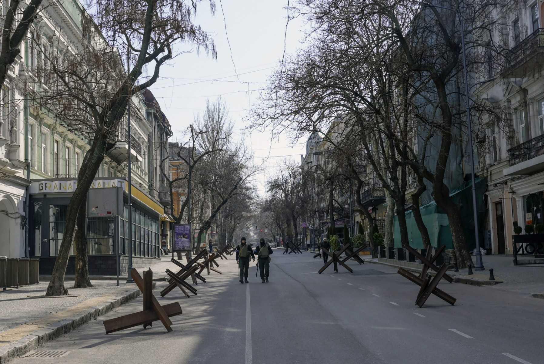 Soldiers walk in an empty street of Odesa in this file picture taken on March 17, 2022. Photo: AFP
