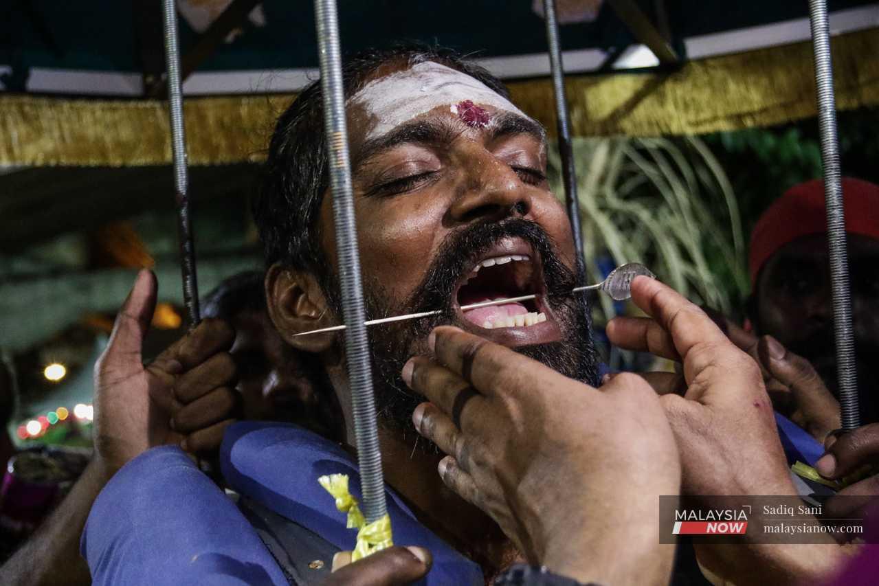 Suresh is then pierced by the 'vel' or the Sword of Lord Murugan.