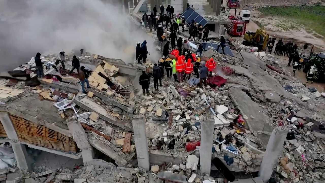 Rescuers search through rubble of collapsed buildings following an earthquake, in the rebel-held town of Sarmada, Syria, Feb 6, in this still image obtained from drone footage. Photo: Reuters