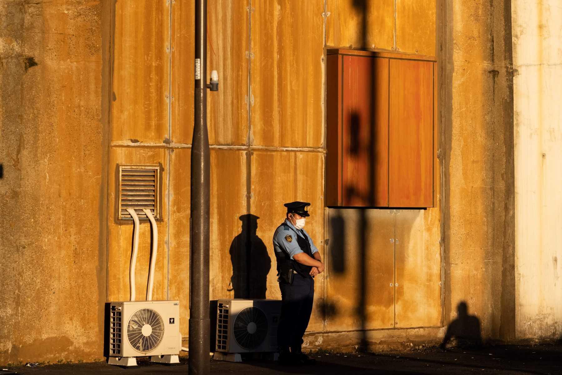A police officer stands guard at the Tokyo 2020 Olympics in Akihabara, district of Tokyo on Aug 4, 2021. Photo: AFP