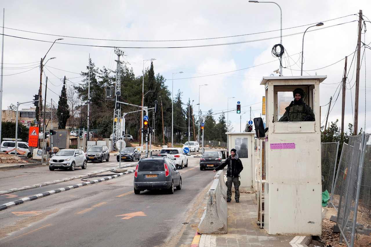 Soldiers stand guard at Gush Etzion Junction in the Gush Etzion settlements compound, in the Israeli-occupied West Bank, Feb 2. Photo: Reuters