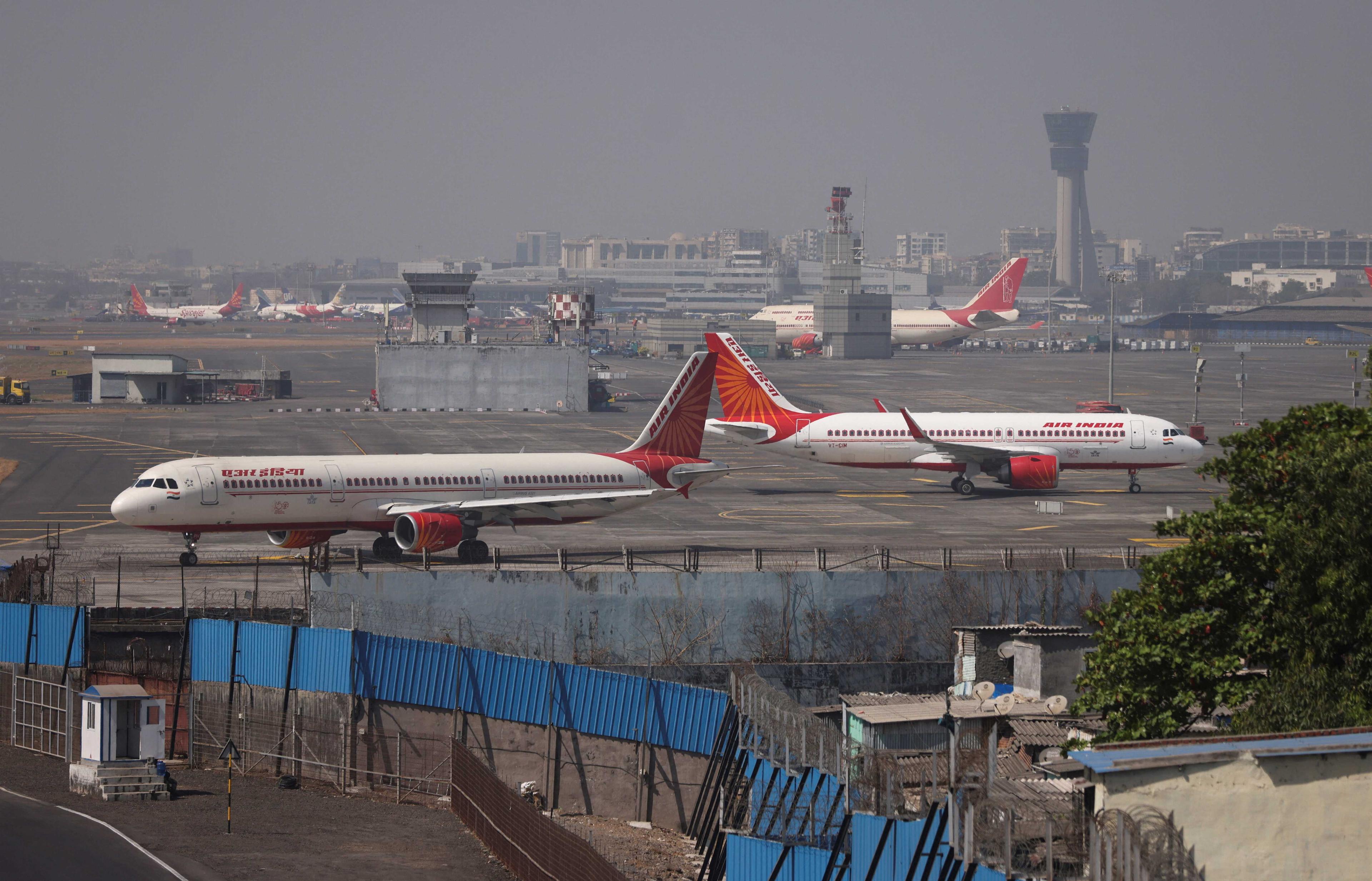 Air India passenger aircraft are seen on the tarmac at Chhatrapati Shivaji International airport in Mumbai, India, Feb 14. Photo: Reuters