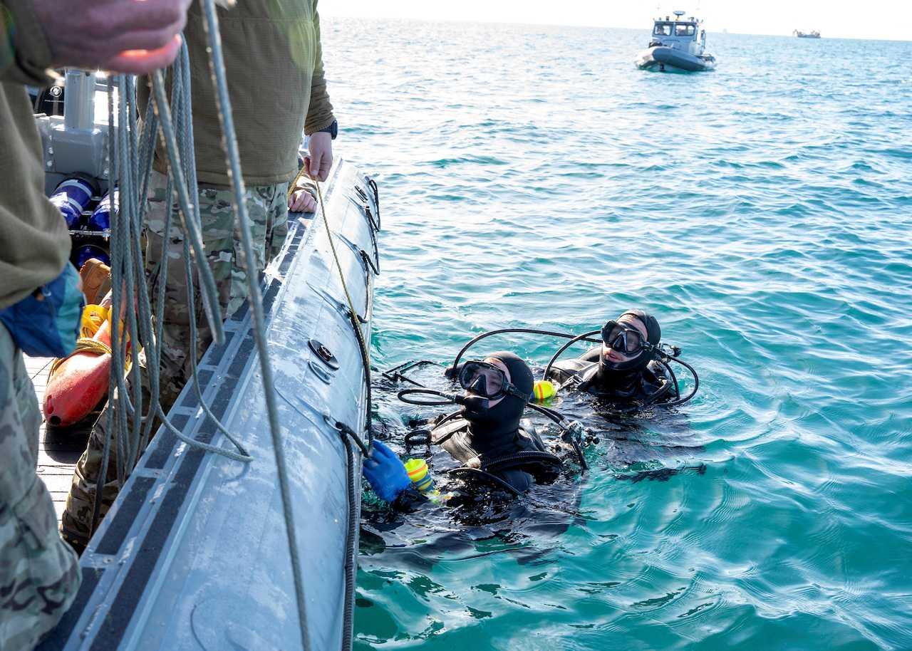 Sailors prepare material recovered in the Atlantic Ocean from a high-altitude Chinese balloon shot down by the US Air Force off the coast of South Carolina for transport to federal agents on Feb 7. Photo: Reuters