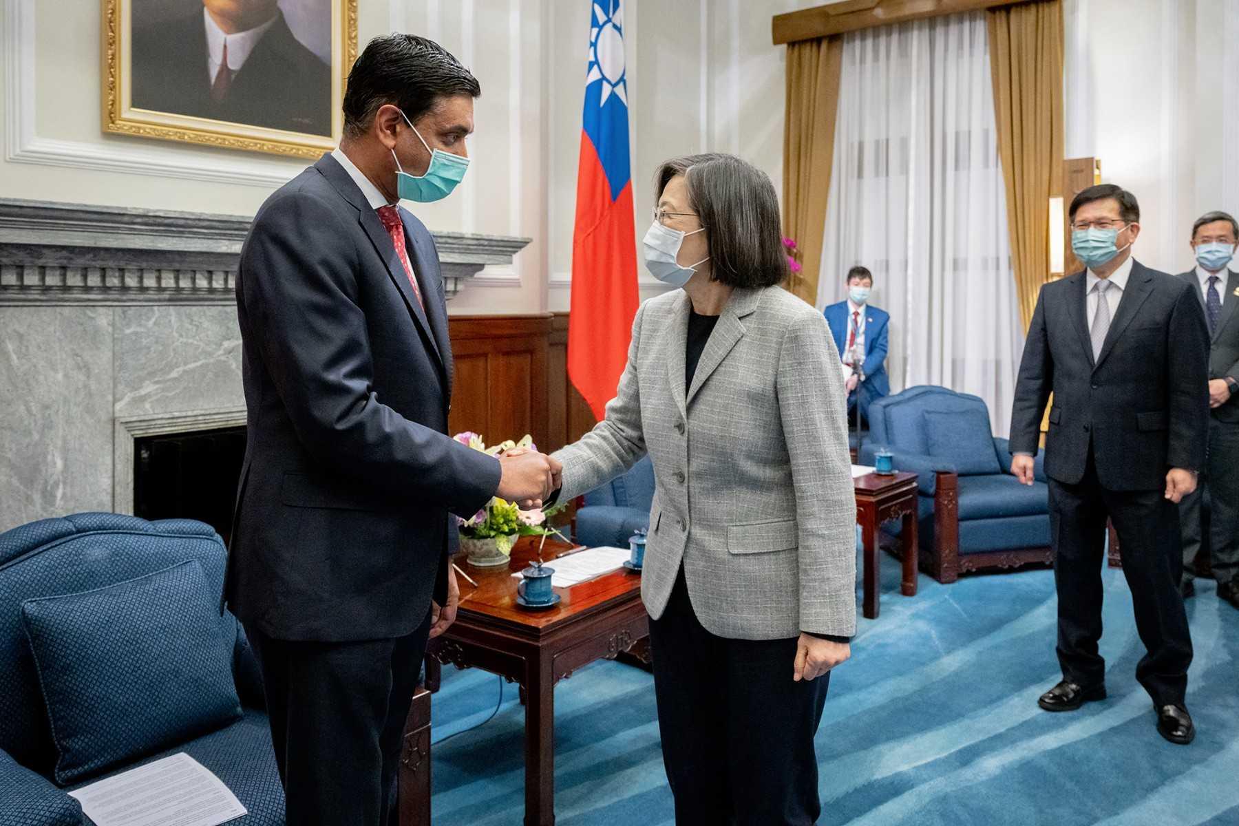 This handout picture taken and released by Taiwan Presidential Office on Feb 21, shows Taiwan President Tsai Ing-wen shaking hands with US Representative Ro Khanna at the Presidential Office in Taipei. Photo: AFP 