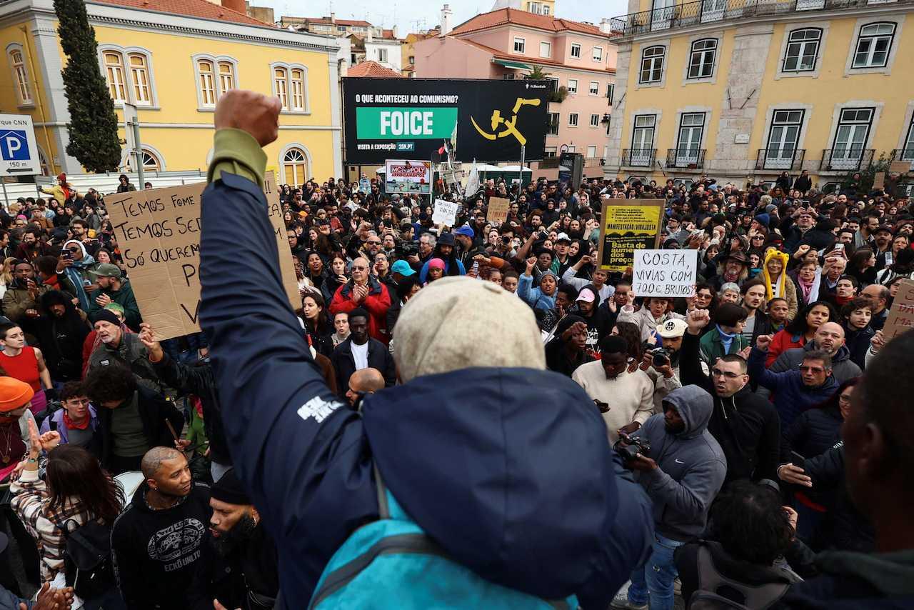 People shout slogans during a demonstration against the mounting costs of living, in Lisbon, Portugal, Feb 25. Photo: Reuters