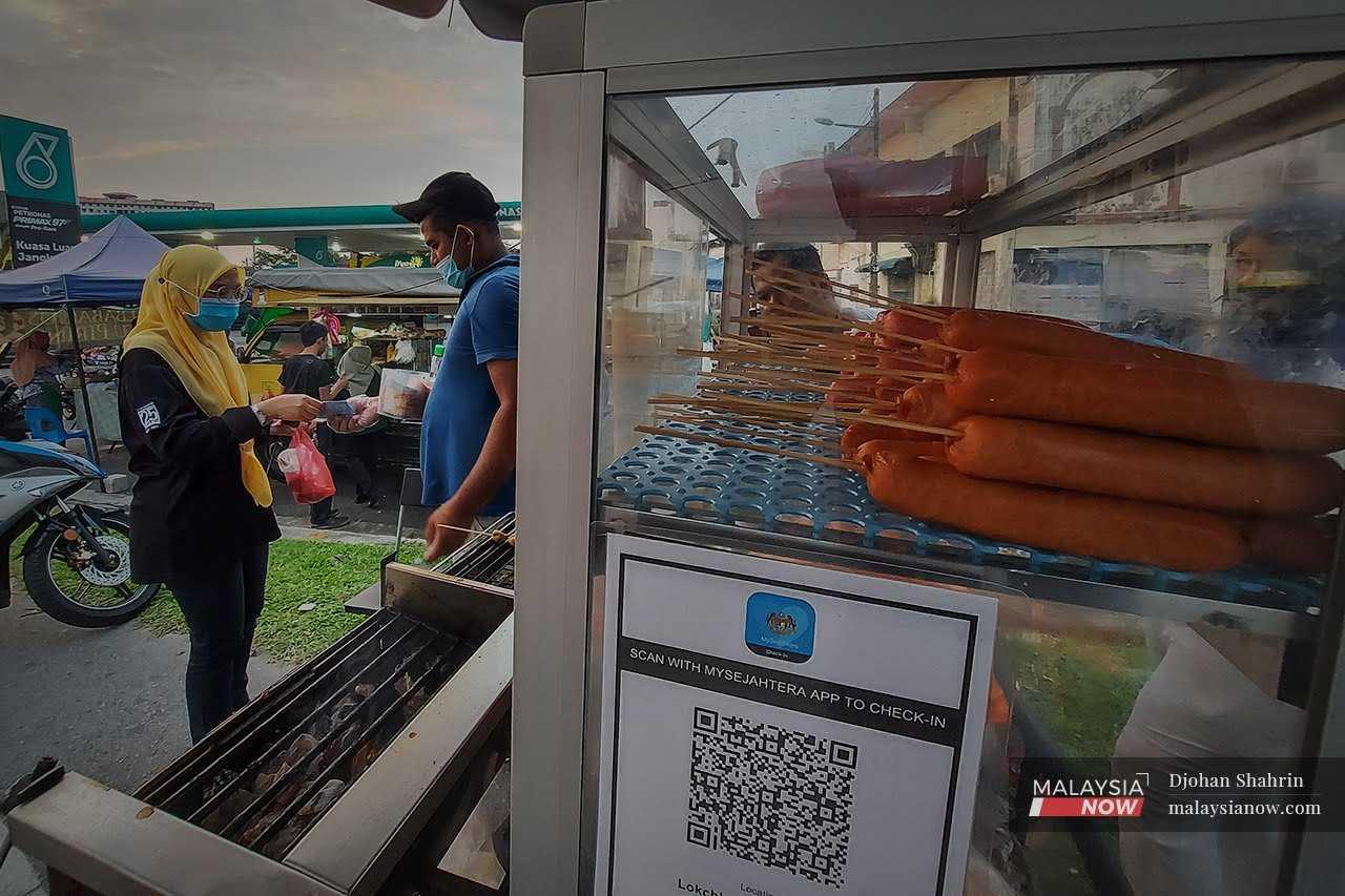 A MySejahtera QR code seen at a roadside stall in Tasik Tambahan, Ampang, Selangor, during the Covid-19 pandemic.