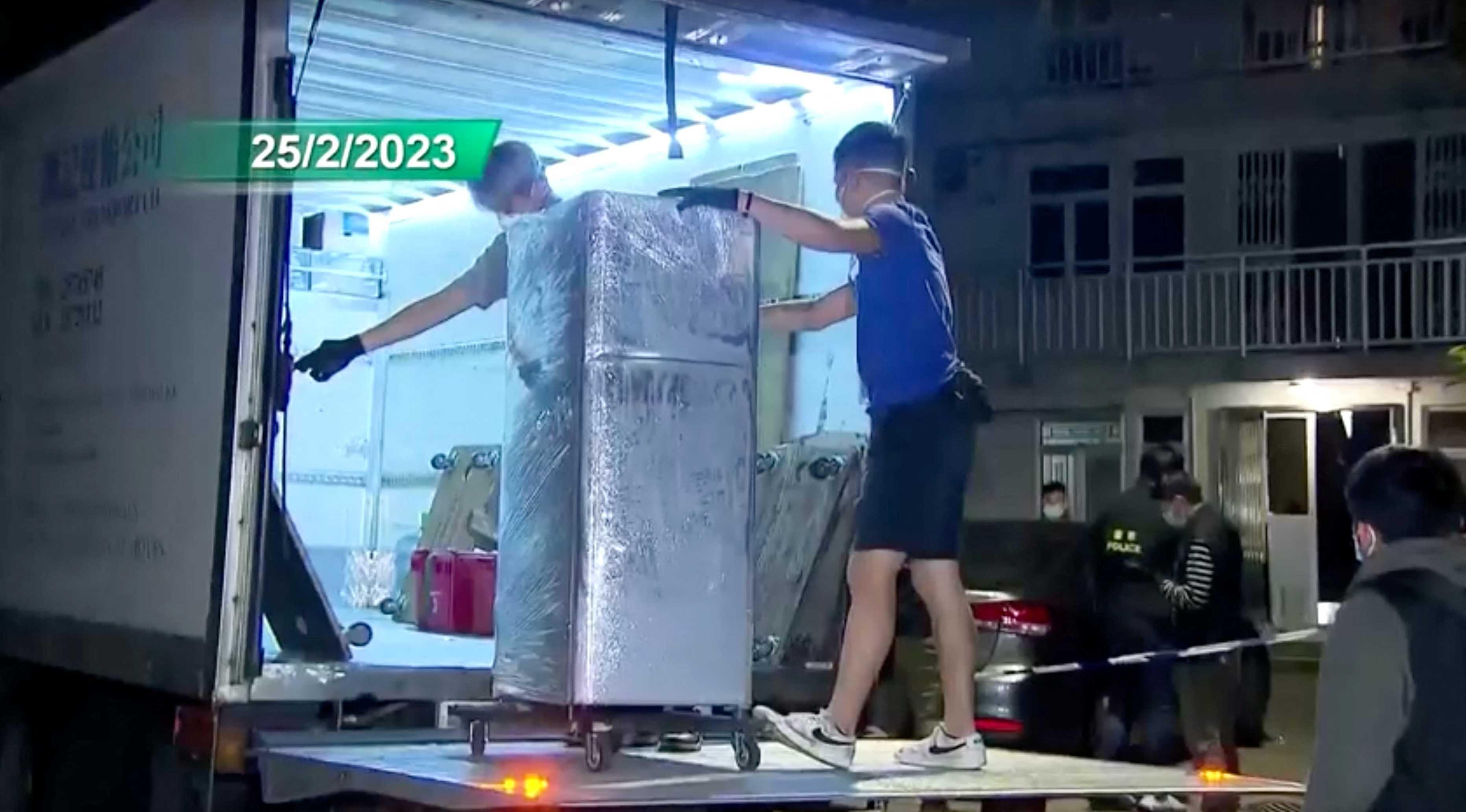 Police loads the refrigerator that is suspected of having been used to keep body parts of 28-year-old model Abby Choi, onto a truck in Hong Kong, China, Feb 25, in this screen grab taken from a handout video. Photo: Reuters