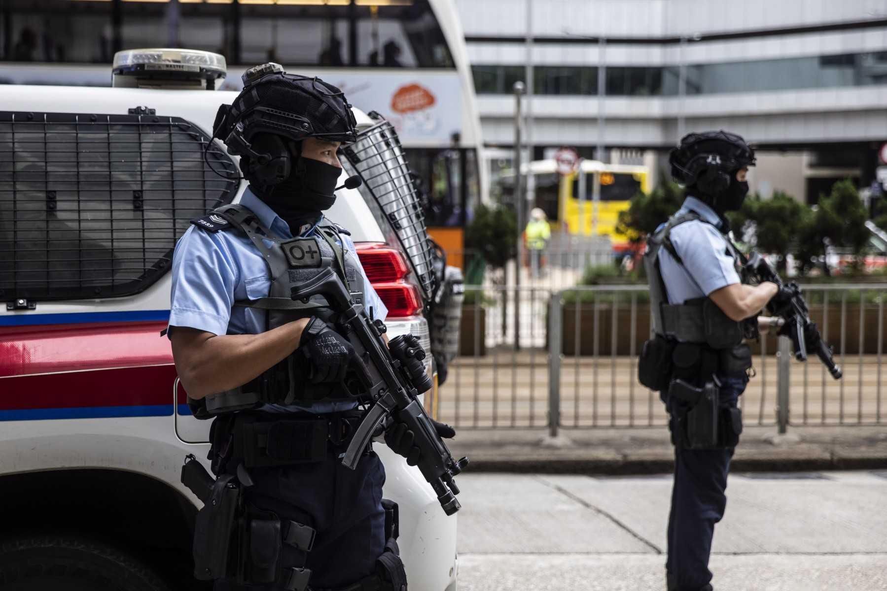 Police stand guard in Hong Kong on Dec 1, 2022. Photo: AFP