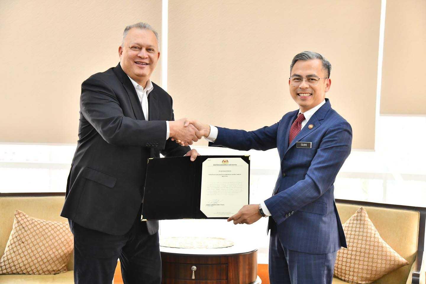 Communications and Digital Minister Fahmi Fadzil with Malaysian Communications and Multimedia chairman Mohamad Salim Fateh Din. Photo: Facebook