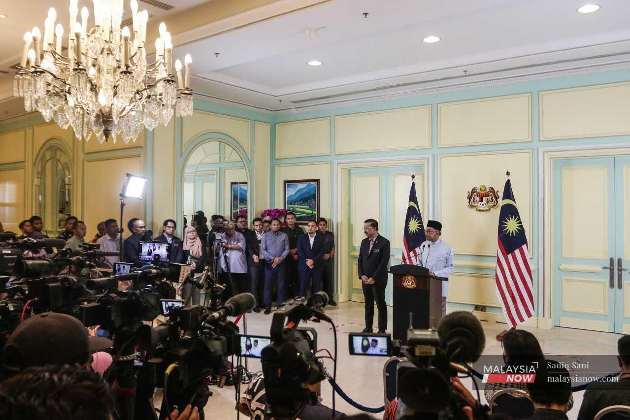Prime Minister Anwar Ibrahim announces his Cabinet line-up, including the controversial appointment of Umno president Ahmad Zahid Hamidi as one of two deputy prime ministers, in Putrajaya, Dec 2, 2022.