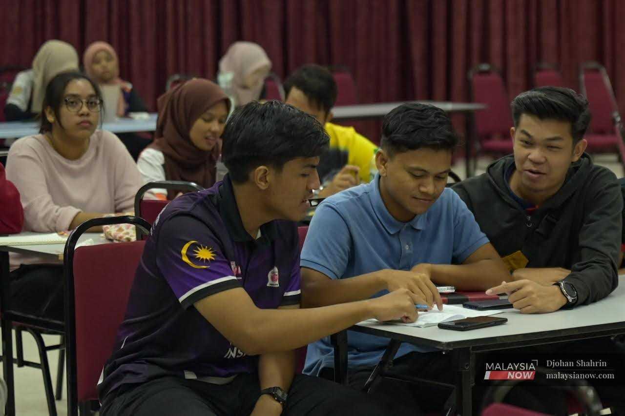 Students gather for a discussion in a hall at a university in Serdang, Selangor, in this file picture.