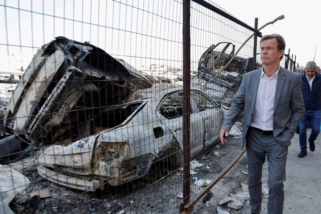 European Union representatives tour an area with destroyed cars, as they and human rights organisations visit Palestinian families after an Israeli settlers' rampage in Huwara, in the Israeli-occupied West Bank, March 3. Photo: Reuters