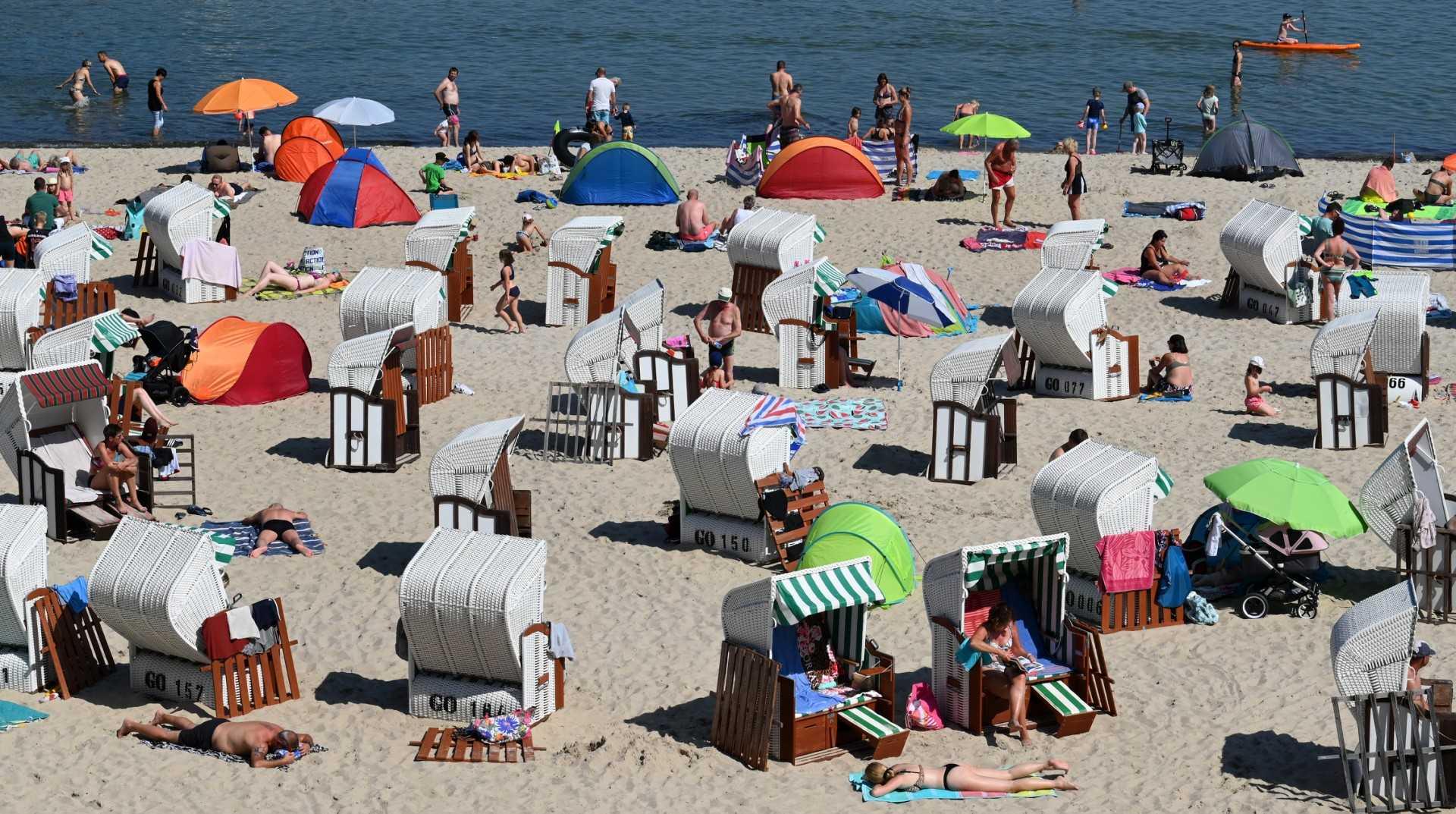 Tourists and beach chairs are seen at the Baltic Sea beach in Sellin on the island of Ruegen, northeastern Germany, on Aug 12, 2021, amid Covid-19. Photo: AFP