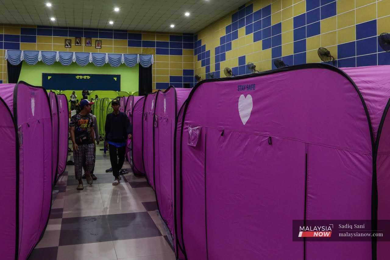 Flood victims stretch their legs at an evacuation centre in Kota Tinggi, Johor.