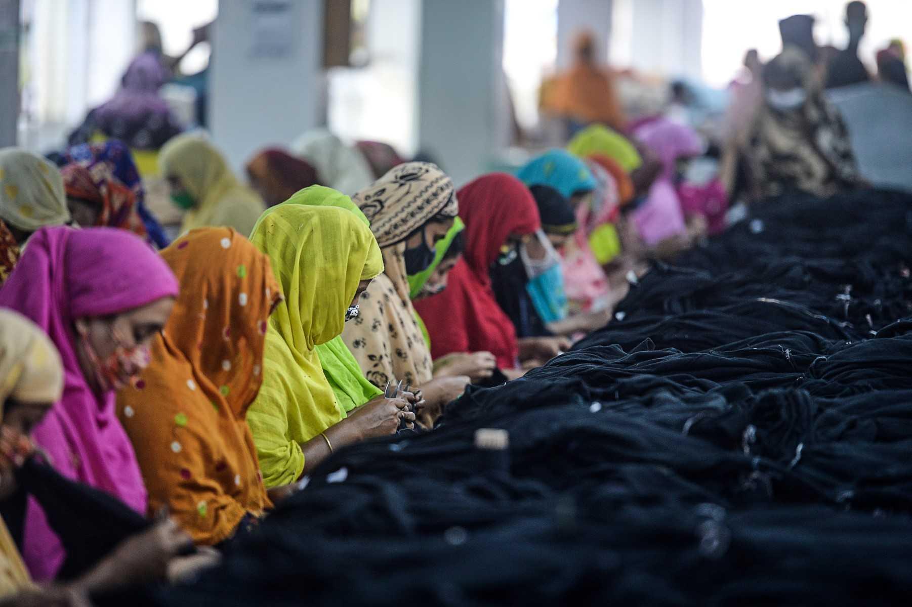 Women work in a garment factory in Gazipur, some 35km from Dhaka on Feb 15, 2021. Photo: AFP 