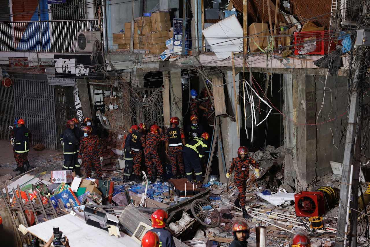 Firefighters and rescue workers are seen on the site of an explosion in a multi-storey building in Dhaka, Bangladesh, March 7. Photo: Reuters