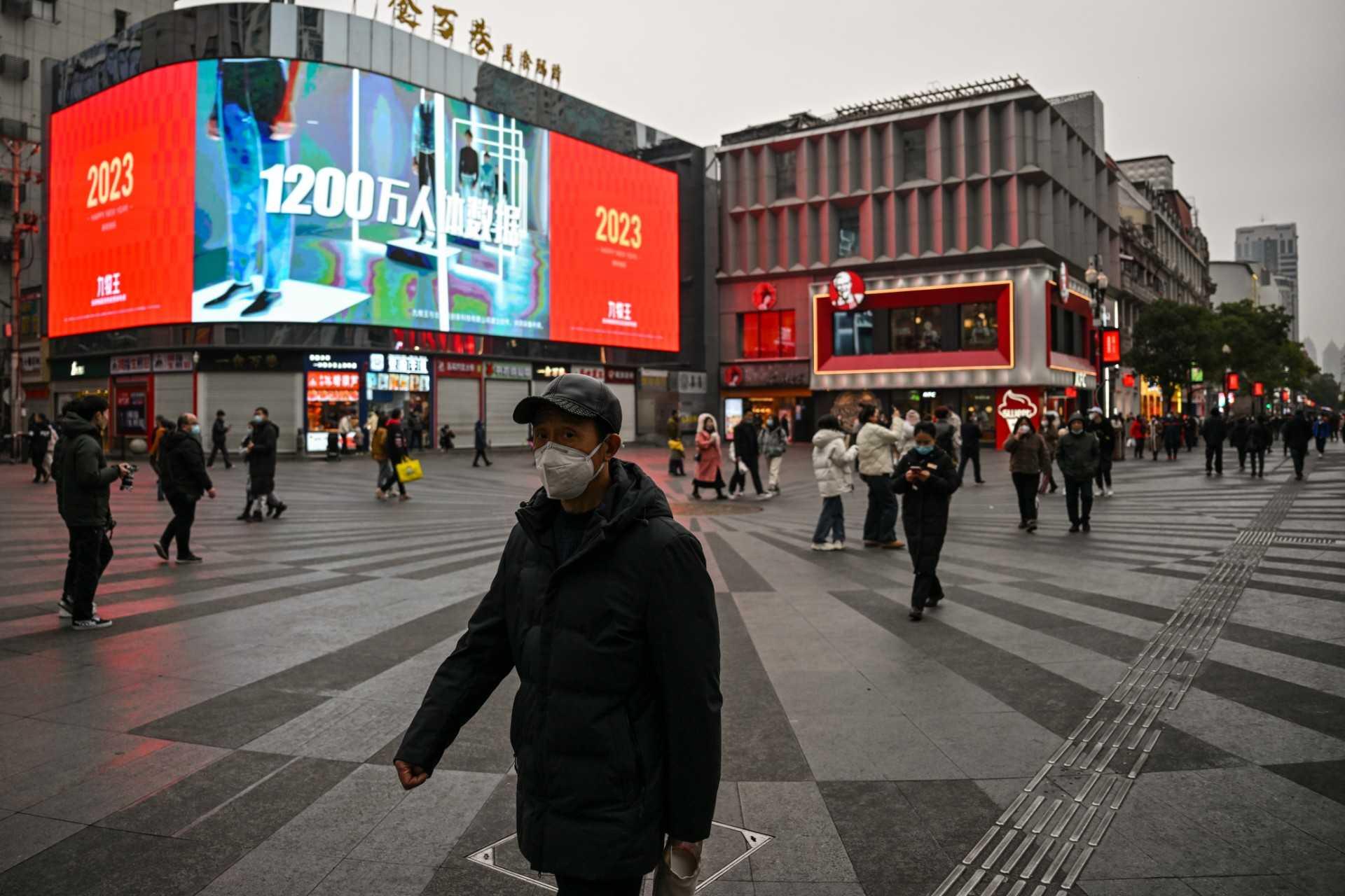 People walk on a street in Wuhan, in China's central Hubei province, on Jan 21. Photo: AFP