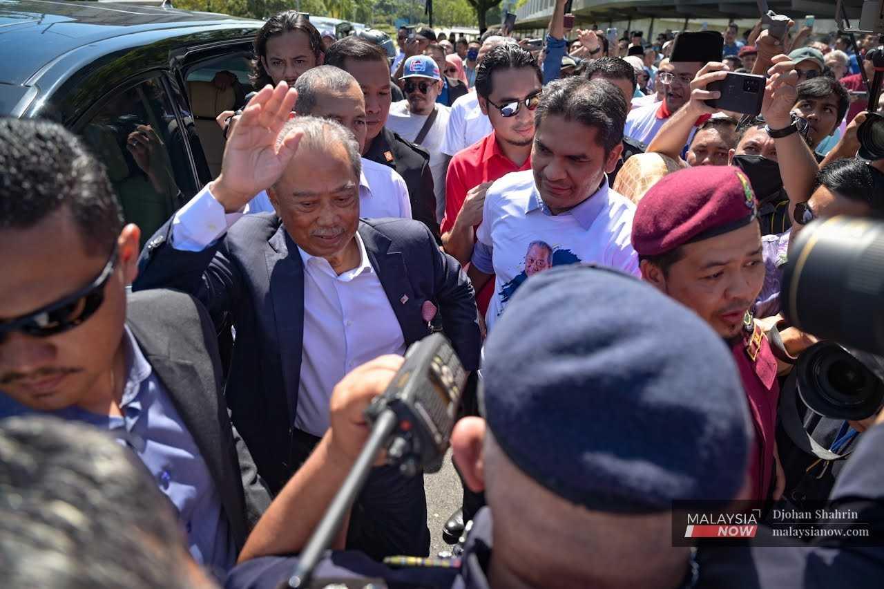 Perikatan Nasional chairman Muhyiddin Yassin arrives for questioning at the Malaysian Anti-Corruption Commission headquarters.