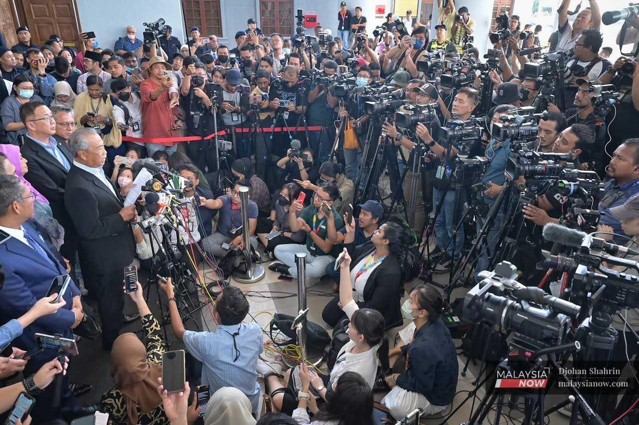 Perikatan Nasional chairman Muhyiddin Yassin speaks to reporters outside the Kuala Lumpur court complex, March 10.