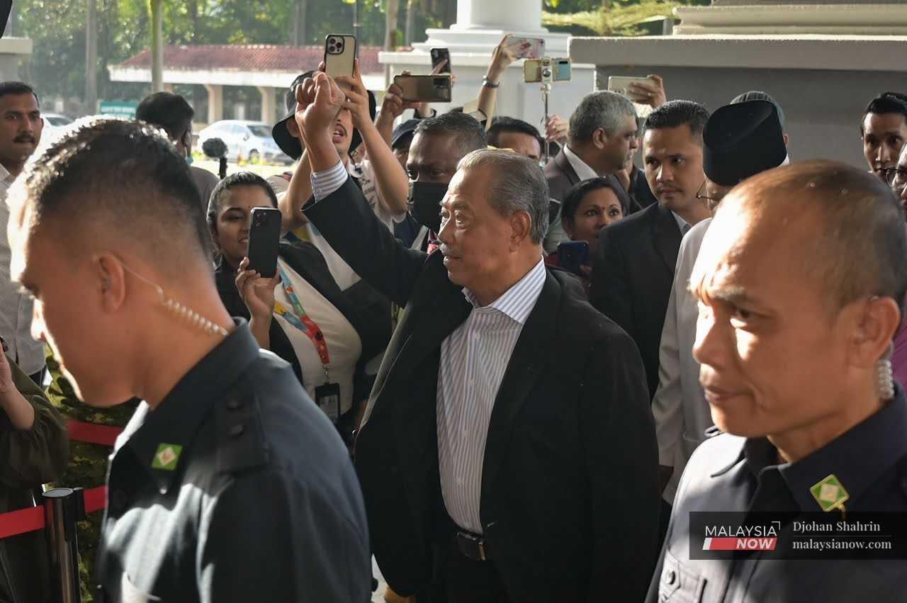 Former prime minister Muhyiddin Yassin arrives at the Kuala Lumpur court complex, March 10. 
