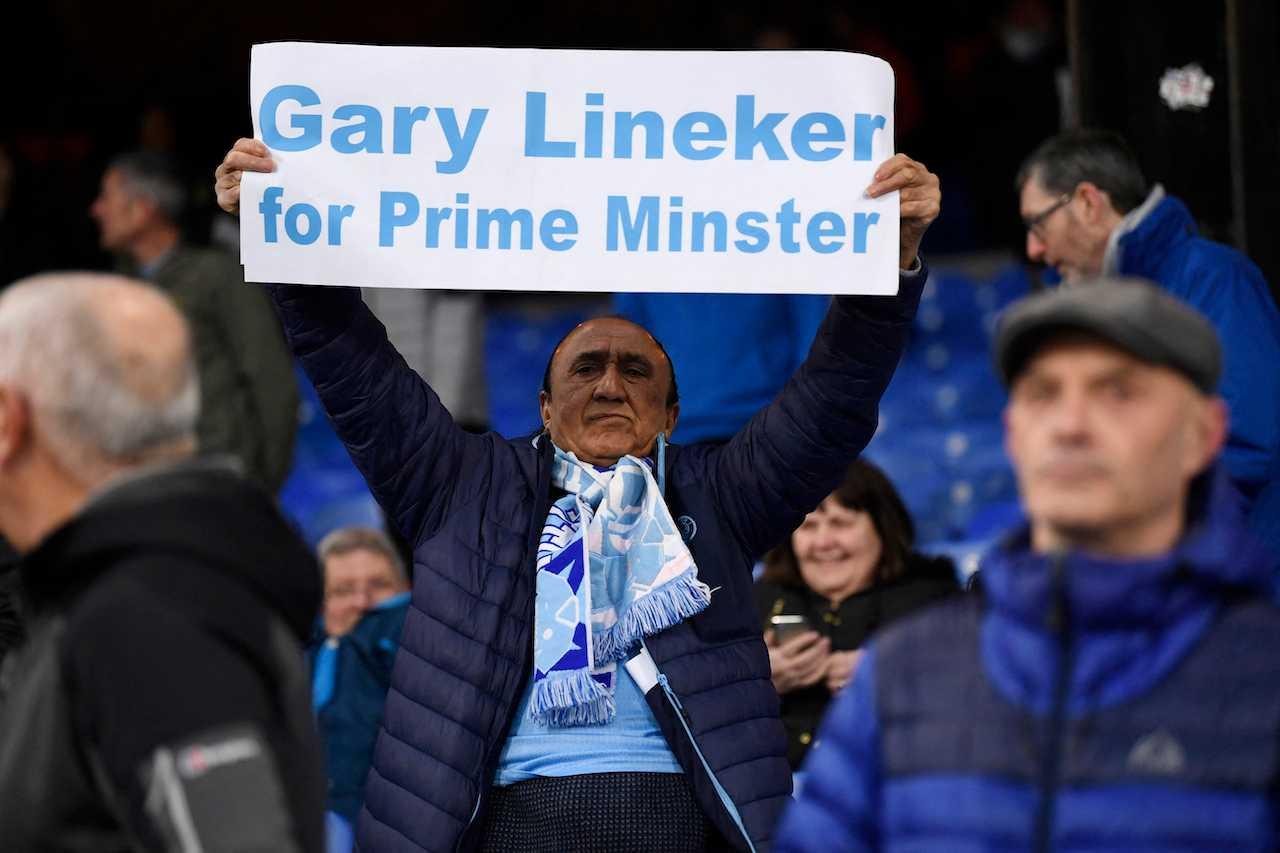 A Manchester City fan holds a sign in support of BBC presenter Gary Lineker at Selhurst Park, London, March 11. Photo: Reuters