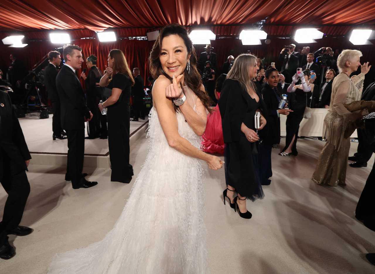 Michelle Yeoh poses on the champagne-coloured red carpet during the Oscars arrivals at the 95th Academy Awards in Hollywood, Los Angeles, California, March 12. Photo: Reuters