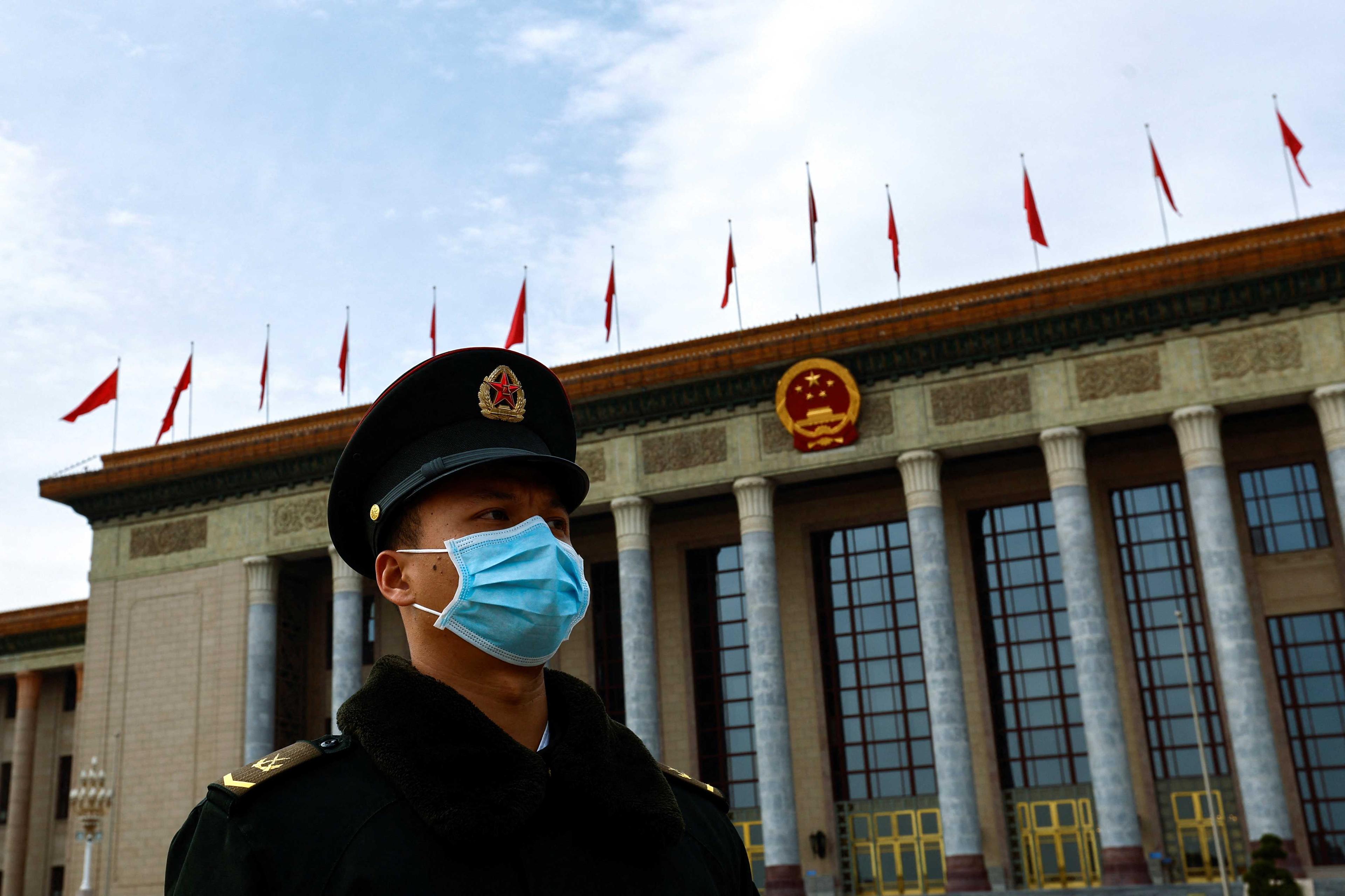 A paramilitary police officer stands guard outside the Great Hall of the People, in Beijing, China March 13. Photo: Reuters