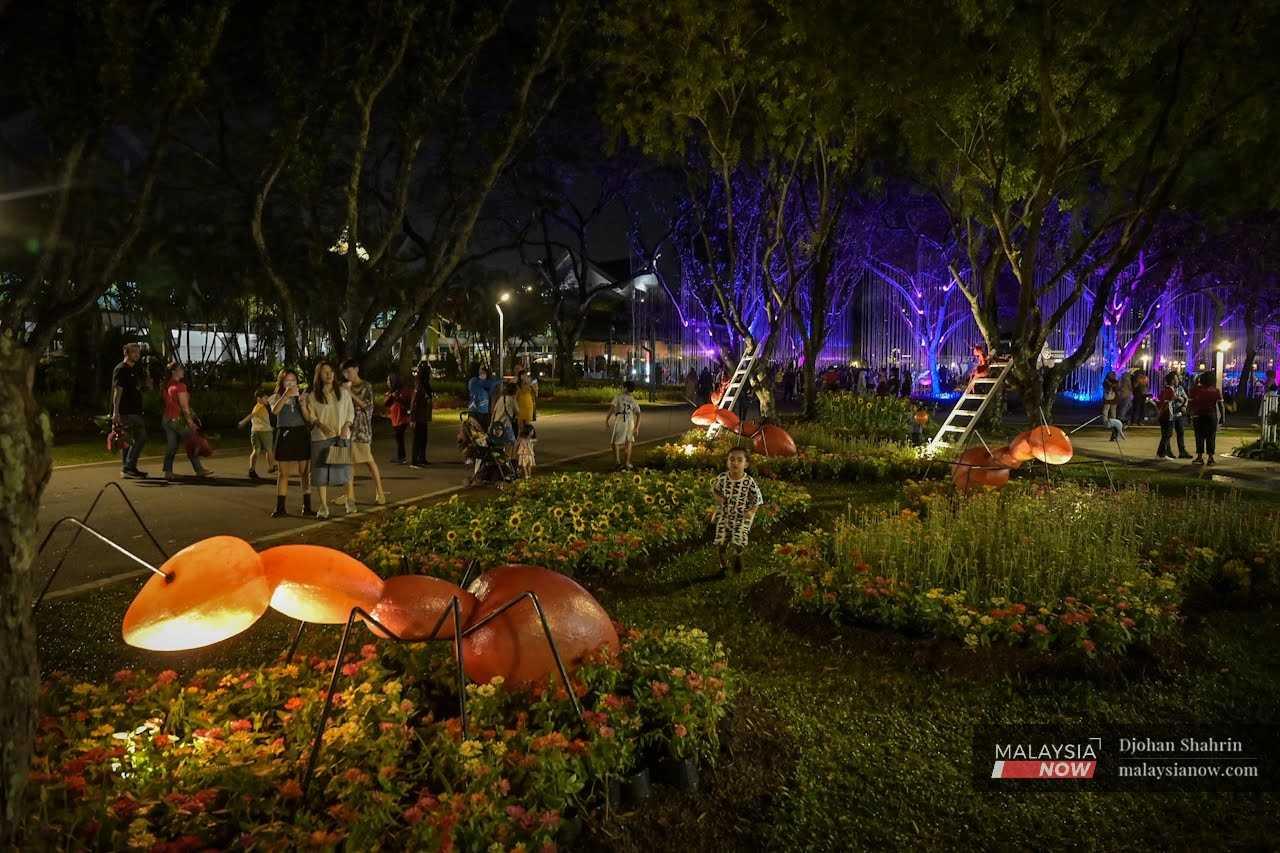 Visitors enjoy the exhibitions and light installations at the KL Park Festival 2023 in Tasik Titiwangsa, Kuala Lumpur. 