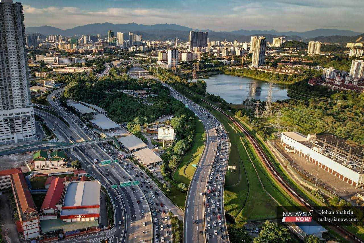 An aerial view of traffic along the Sungai Besi-Salak South Highway and the MEX expressway heading to Putrajaya. 