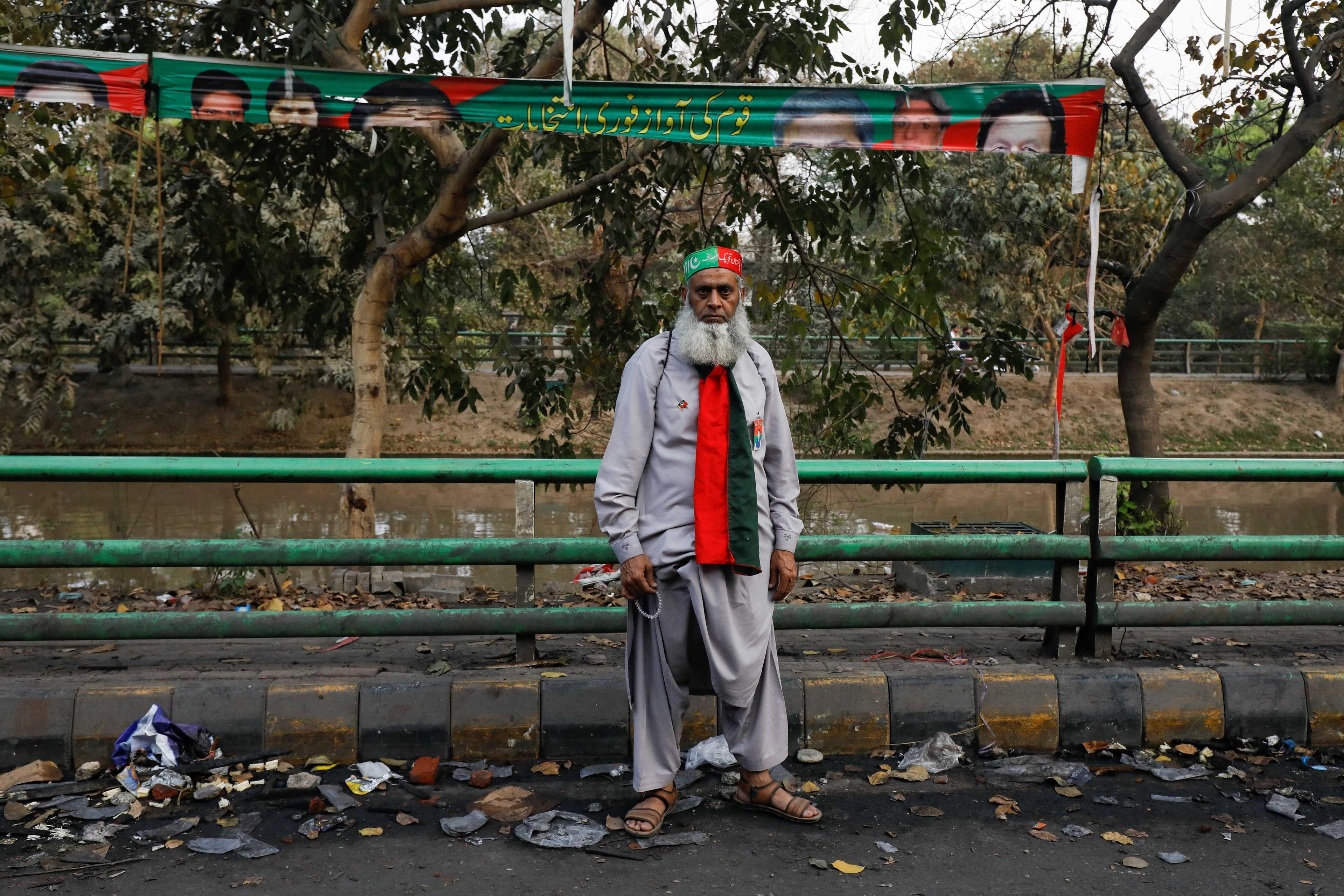 A supporter poses for a photograph outside the house of former Pakistani Prime Minister Imran Khan, after police postpone the arrest of Khan, in Lahore, Pakistan March 15. Photo: Reuters