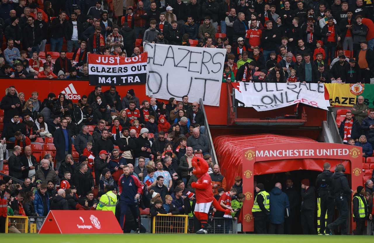 Manchester United fans display protest banners inside the Old Trafford stadium in Manchester, Britain, March 12. Photo: Reuters