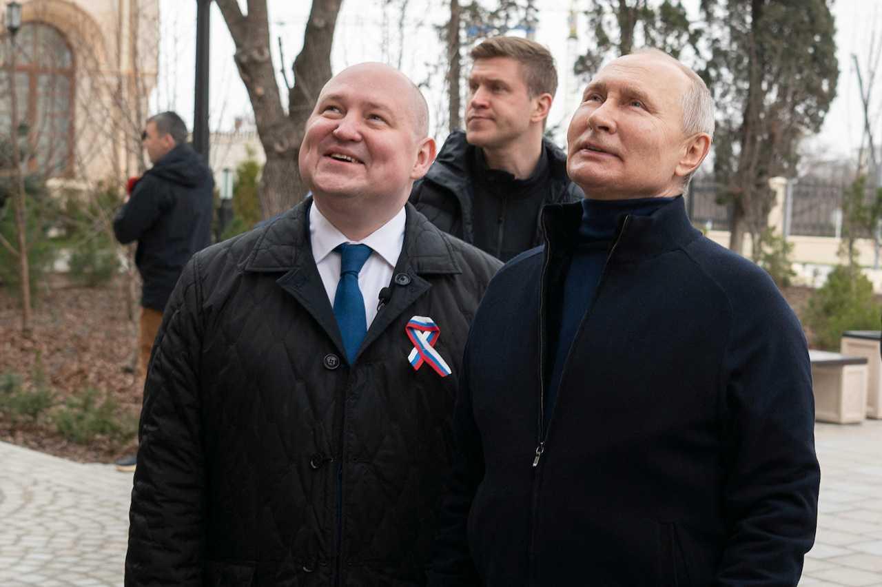 Russian President Vladimir Putin and Governor of Sevastopol Mikhail Razvozhayev in Sevastopol, Crimea, March 18. Photo: Reuters